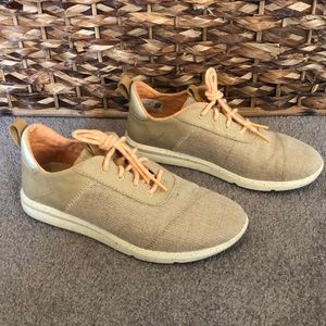 Tan canvas gym shoes by Toms